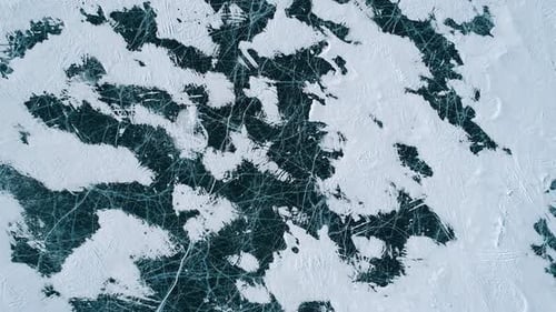 Aerial Over the Blue Snowy Cracked Ice of Baikal Winter Landscape of Frozen Baikal