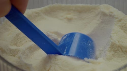 Close-up view of powdered milk highlighting texture and color details