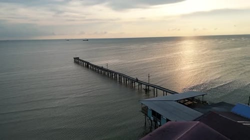 A pier is visible in the distance. Aerial sunset Segenting, Batu Pahat.