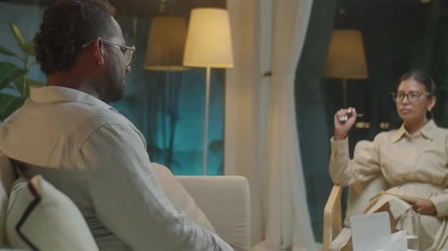 Asian Female Therapist Listening to Patient on Counseling Session