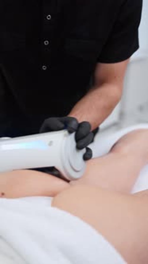 Professional Performs Endospheres Therapy Massage on Clients Thigh Reducing Cellulite in Spa Clinic