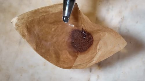 Coffee brewing process with manual coffee brewing equipment. slow brewing. pour over