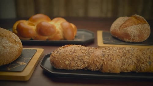 Variety of Fresh Breads on a Wooden Table