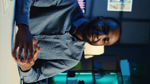 Man Explains Technology Concept in Modern Office