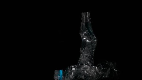 Crumpled Plastic Bottle on Black Background