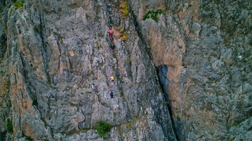 Rock Climbers on Mountain Cliff