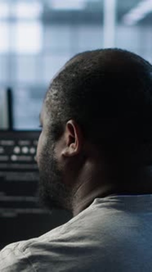 Admin Working in Computer Network Security Data Center Listening Music