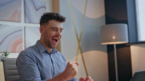 Excited Winner Rejoicing Workplace Reading Great News at Laptop Office Closeup