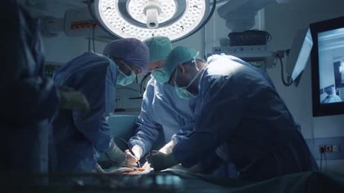 Medical Team Performing Surgical Operation in Modern Operating Room
