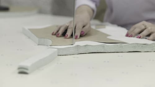 Garment Fabric Cutting is Done in a Workshop Using Hands and Tools with Precision and Craftsmanship