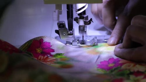 Sewing Machine Stitching Floral Patterned Material Close Up