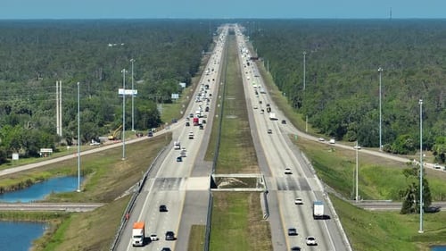 Top View of Mulitlane American Highway with Rapid Driving Cars During Rush Hour in Florida View From
