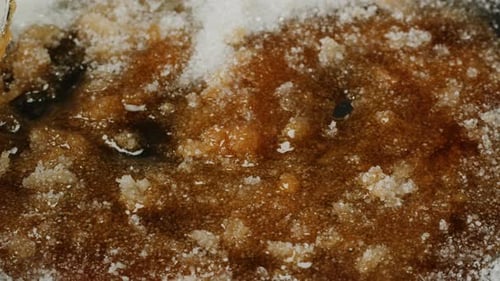 Close Up of Boiling Sugar with Bubbles Turns Into Caramel Caramelization Chef Cooking Dessert in