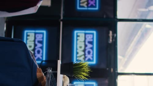 Store Advertising Black Friday Sale on Screens