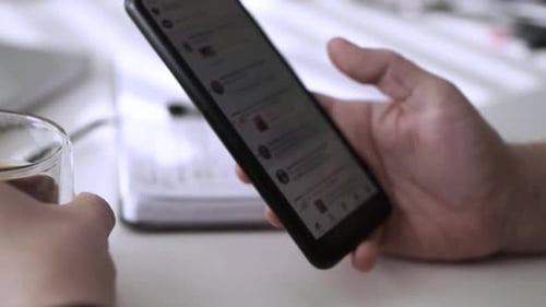 Man scrolling social media in smartphone