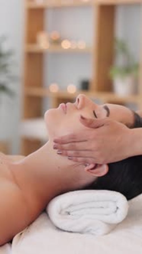 Relaxing Face Massage for Young Woman in Spa