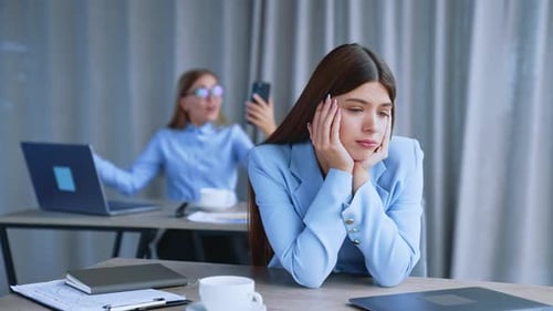 Cheerful young female managers at office. Professional young lady colleague.