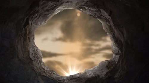 Cave Opening with Bright Light Rays and Moving Clouds