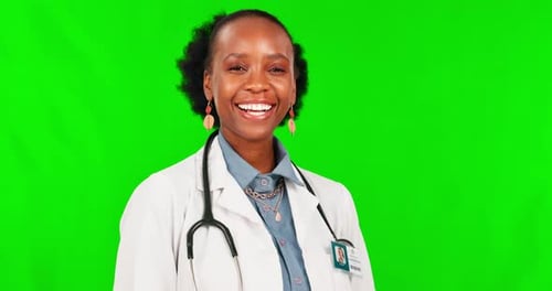 Face, laughter and a doctor black woman on a green screen background in studio for healthcare