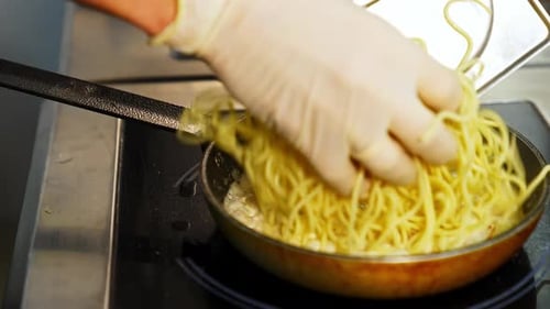 Cooking Spaghetti in Sauce in a Pan