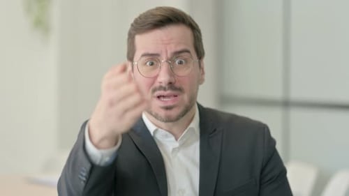Professional Man Communicating Directly with Hand Gestures