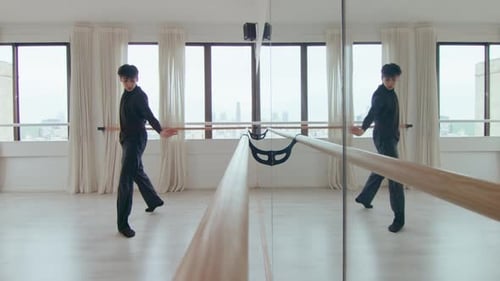 Male Dancer Choreographing Contemporary Dance by Mirror Wall at Studio