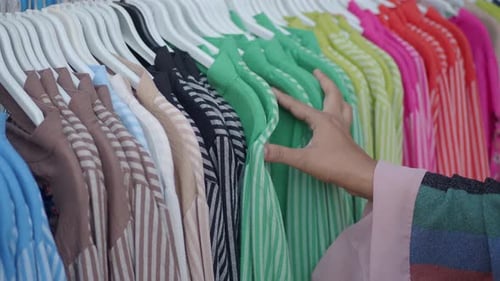 Woman Choosing Clothes in Shop