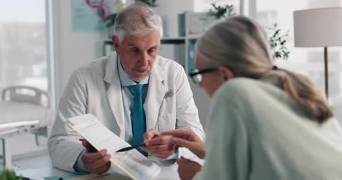 Doctor Discussing Medical Report with Patient