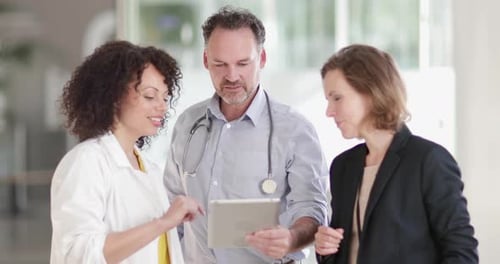 Medical Doctors discussing successful treatment of a patient