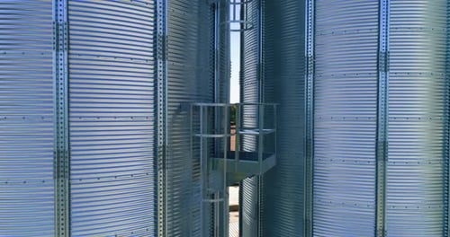 Metal elevator in agriculture zone. Grain Warehouse or depository.