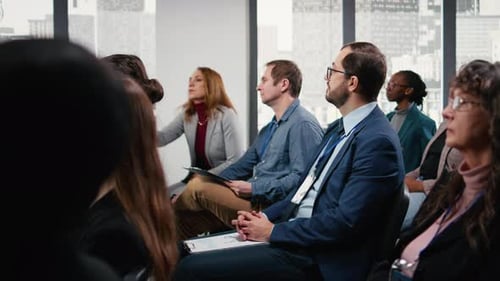 Diverse Group Listens at Business Conference, Asks Questions