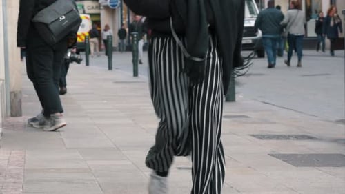 People walking on a busy street.