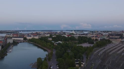 Aerial Panoramic View of Urban Borough at Dusk Fly Above Rail Yard Near Central Train Station