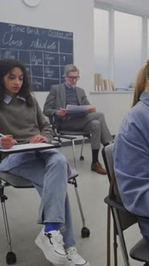 Diverse Students Attending Class in Brightly Lit Classroom