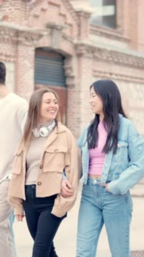 Multiethnic Lesbian Couple Walking on the Street