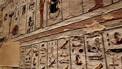 Egyptian hieroglyphs on the walls of the tombs of the pharaohs. Egyptian symbols and pharaohs writin