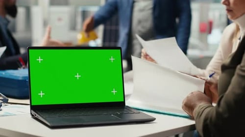 Industrial Plant Manager Typing on Green Screen Laptop