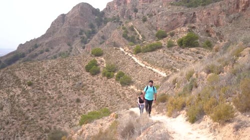 Hikers group walk along a rout in the mountain.