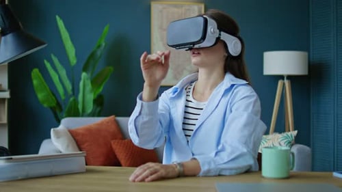 Woman Wearing Virtual Reality Goggles Sitting in Home Office Living Room VR Glasses Virtual Reality