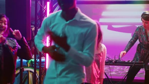 Diverse People Dancing on Music at Club