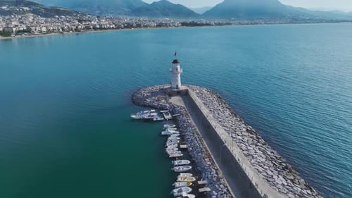 Aerial Videoin a Bay Surrounded By Rocky Cliffs and Clear Waters Seen From Above