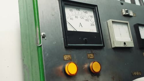 Electrical test bench ammeter and a hand in white gloves presses buttons with the inscriptions