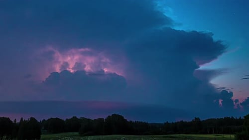 Powerful Lightning Strikes Over Rural Landscape at Night