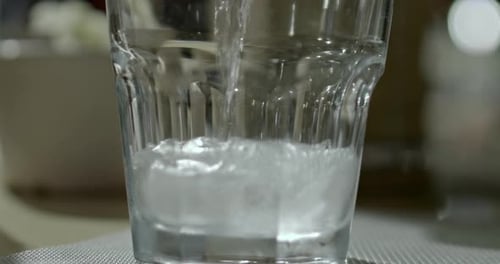 Fizzing Soda Drink Being Poured Over Ice