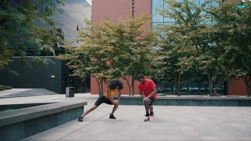 Couple Warming Up Together in a City Square