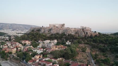 Aerial view of the Acropolis of Athens, Greece. Slowly rise up and revealing the Acropolis ant the b