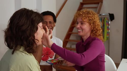 Friends Applying Makeup in Home Setting
