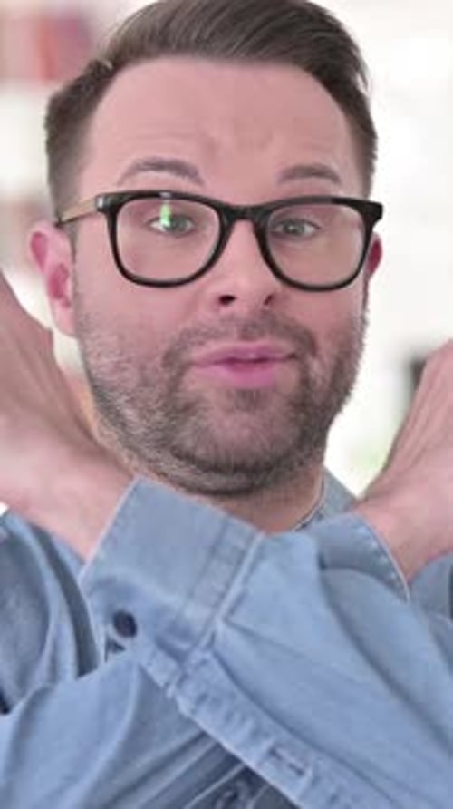 Man Expressing No With Arms Crossed and Facial Expression