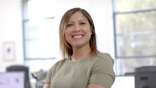 Portrait of happy caucasian casual businesswoman in office, slow motion