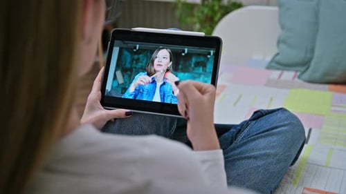 Woman Watching Video Lesson on Tablet